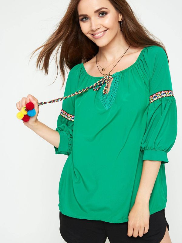 Yups Blouse with decorative green binding