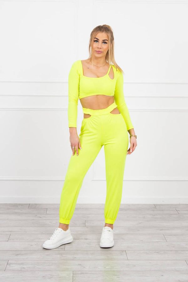 Kesi Complete with a yellow neon-colored blouse top