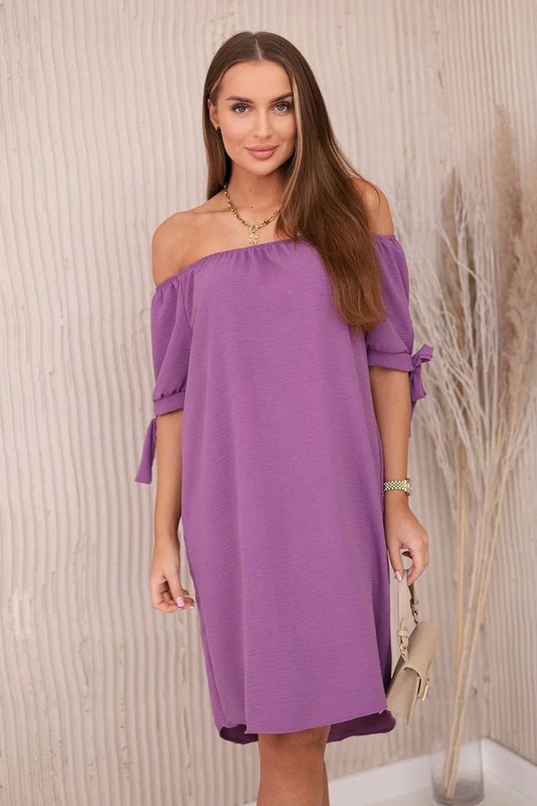 Kesi Dress with a longer back and ties on the sleeves plum
