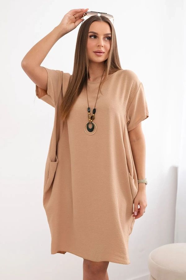 Kesi Dress with pockets and a Camel pendant