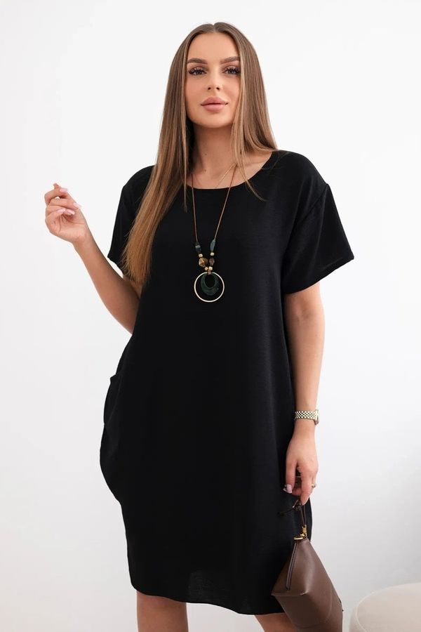 Kesi Dress with pockets and pendant in black