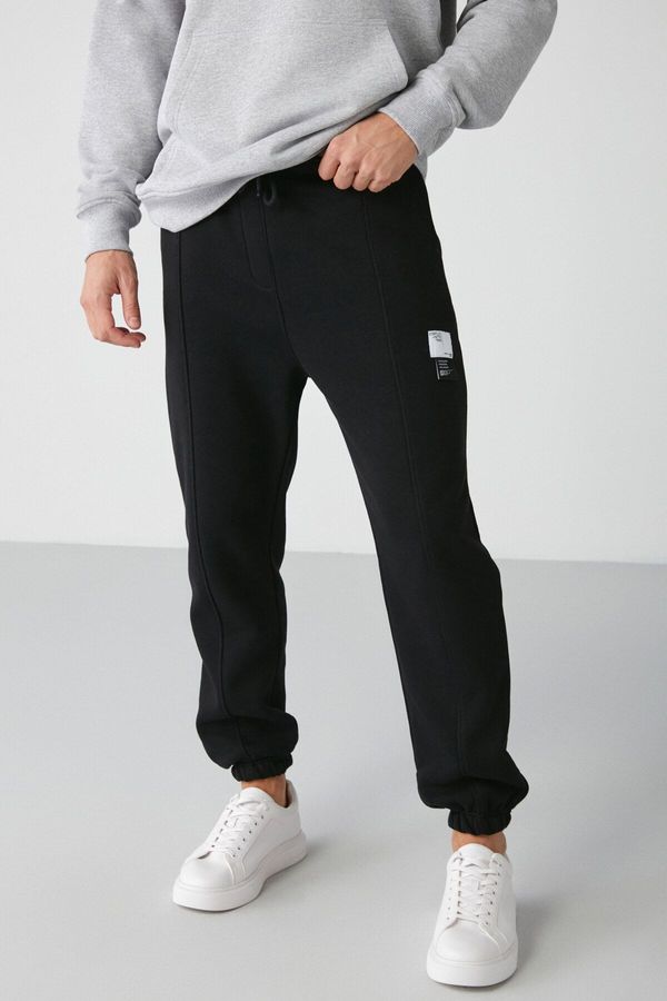 GRIMELANGE GRIMELANGE Rowan Men's Relaxed Black Sweatpants with Ribbed Front Decorative Label and Lined Interior