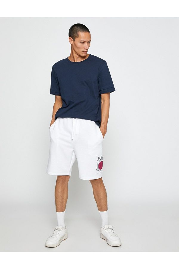 Koton Koton Basic Sports Shorts with Asian Print with a drawstring waist and pocket.