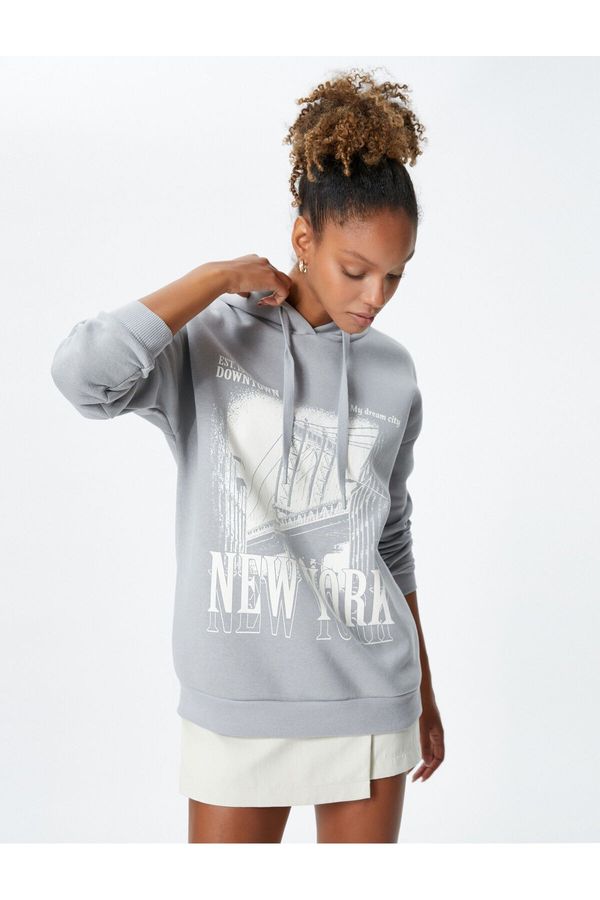 Koton Koton Hooded Sweatshirt with a slogan printed, relaxed fit and long sleeve.