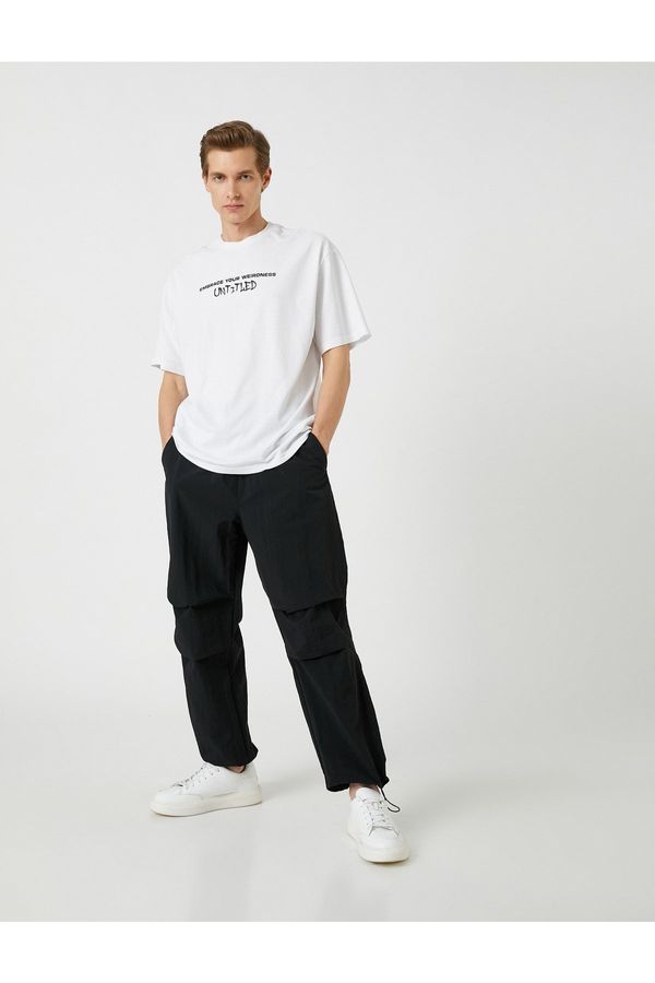 Koton Koton Parachute Trousers with a loose fit, lacing at the waist, and elasticated legs with a pocket detail.