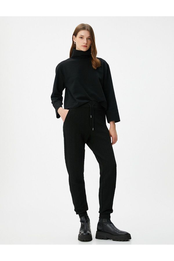 Koton Koton Textured Jogger Sweatpants with a drawstring waist and pockets.