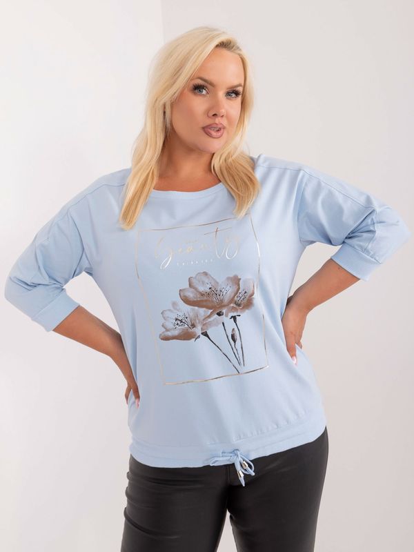 Fashionhunters Light blue women's oversized blouse with drawstrings