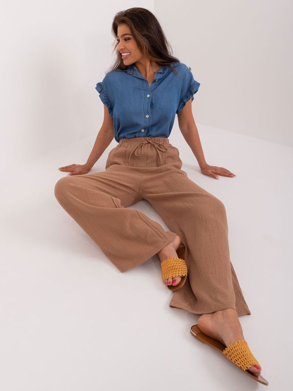 Fashionhunters Light brown women's fabric trousers with pockets