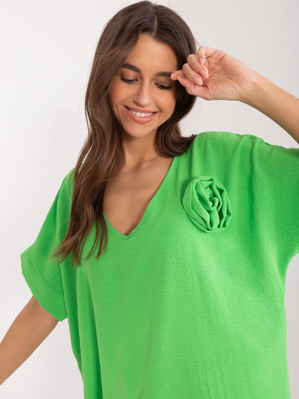 Fashionhunters Light green oversize blouse with flower