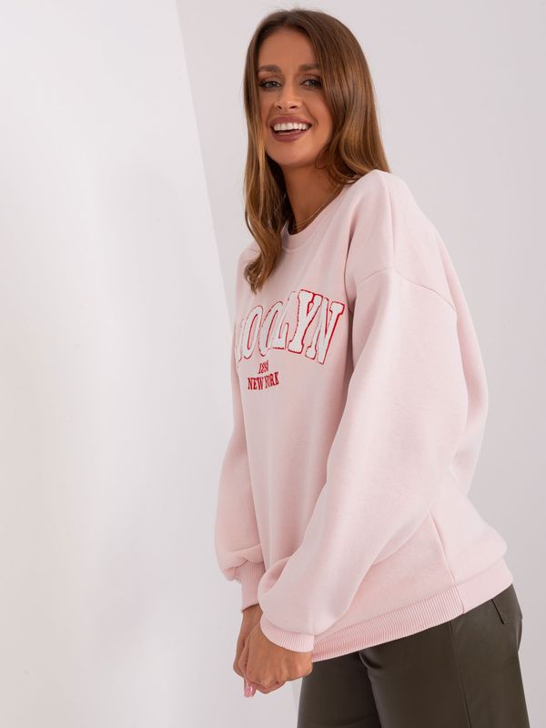 Fashionhunters Light pink oversize sweatshirt with inscription