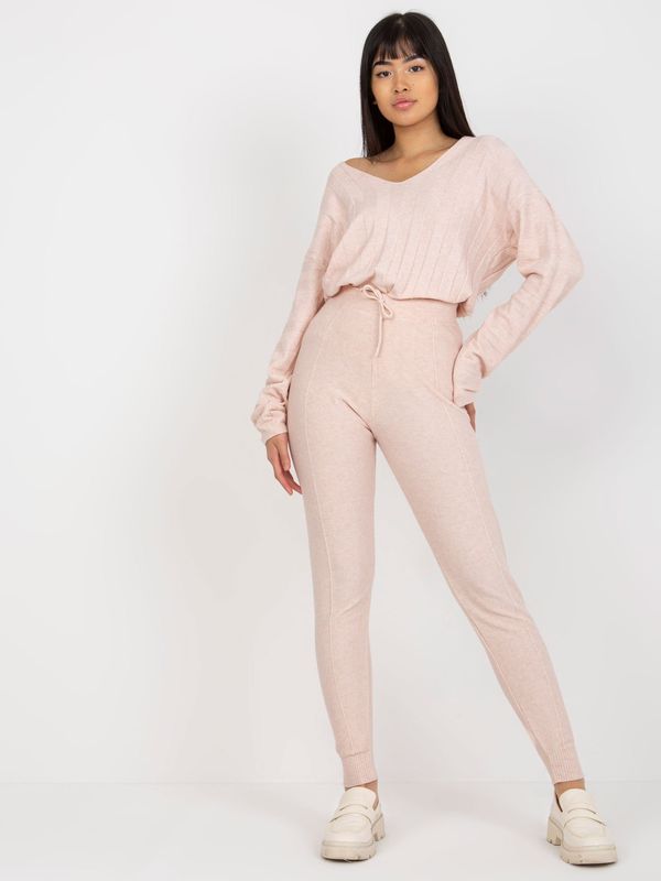 Fashionhunters Light pink women's knitted trousers with tie