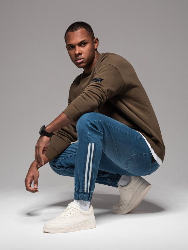 Ombre Ombre Men's denim joggers with asymmetrical stitching - blue