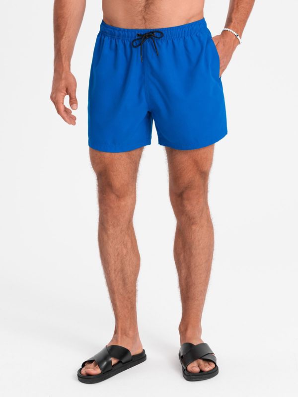 Ombre Ombre Neon men's swim shorts with magic print effect - blue