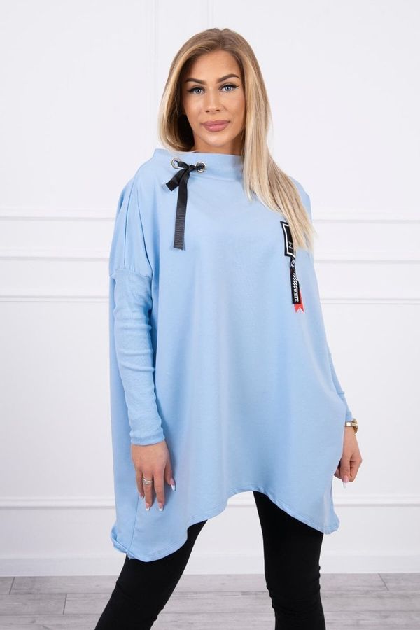 Kesi Oversize sweatshirt with asymmetrical sides of cyan color
