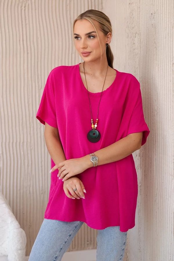 Kesi Oversized blouse with fuchsia-colored pendant