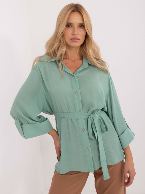 Fashionhunters Pistachio women's oversize shirt with a longer back