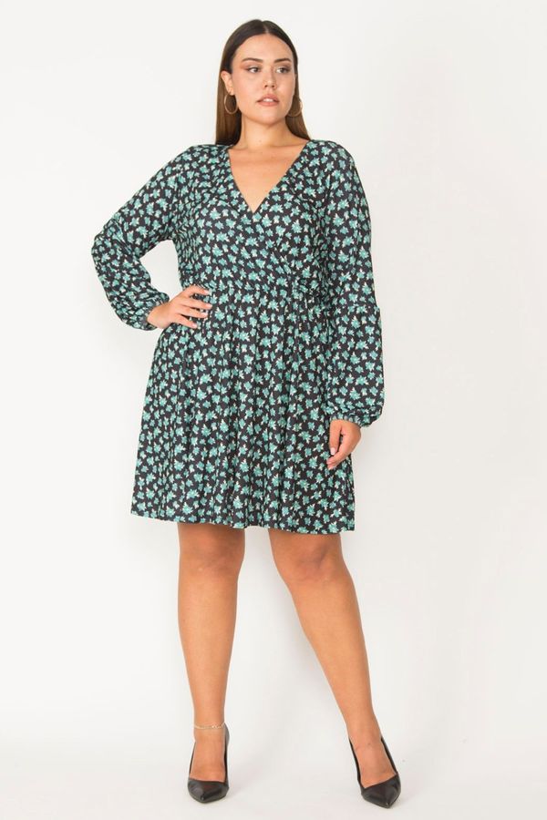 Şans Şans Women's Plus Size Green Dress with a wrapover collar with elastic detail around the armholes and waist.