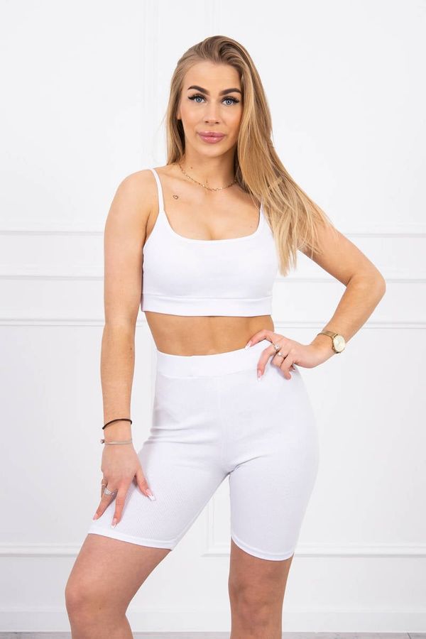 Kesi Set with white high-waisted trousers