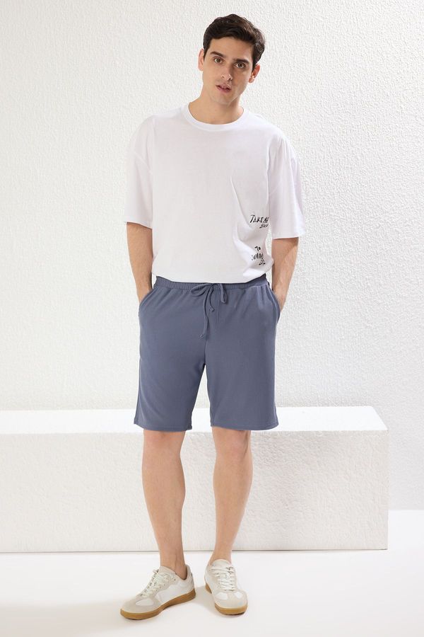 Trendyol Trendyol Limited Edition Indigo Oversize/Wide Cut Textured Wrinkle-Free Ottoman Shorts