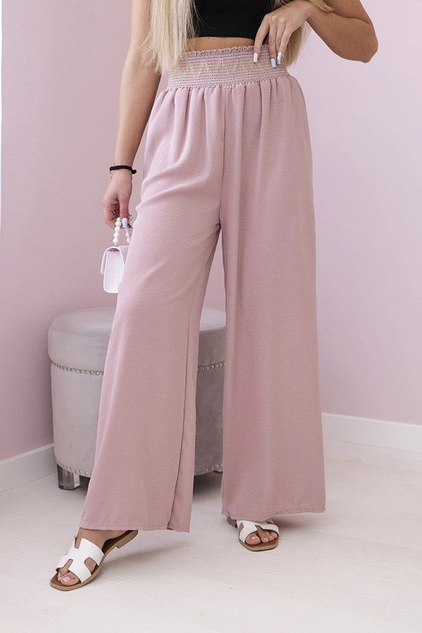 Kesi Trousers with a wide elastic waistband in dark pink colour
