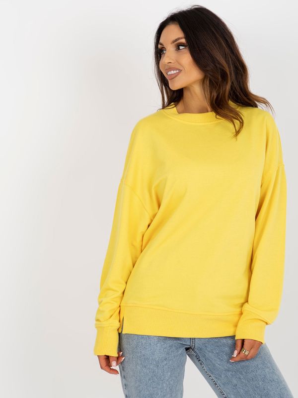 Fashionhunters Yellow loose hoodie with round neckline